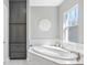 Luxurious bathroom features a soaking tub, built-in storage, and elegant fixtures at 7415 Paradiso Dr, Apollo Beach, FL 33572