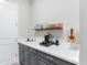 Convenient butler's pantry with sleek countertops, storage cabinets and beverage station perfect for entertaining guests at 7415 Paradiso Dr, Apollo Beach, FL 33572