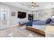 Relaxing main bedroom featuring hardwood floors, plenty of natural light and a calming color palette at 7415 Paradiso Dr, Apollo Beach, FL 33572