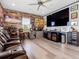 Entertaining rec room with hardwood floors, stadium seating and a bar with beverage center at 7415 Paradiso Dr, Apollo Beach, FL 33572
