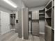 Spacious walk-in closet with custom shelving, drawers, and ample storage space to keep things organized at 7415 Paradiso Dr, Apollo Beach, FL 33572