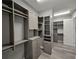 Spacious walk-in closet with custom shelving, drawers, and ample storage space at 7415 Paradiso Dr, Apollo Beach, FL 33572