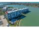 Aerial view of condominium complex on the water with pool and manicured grounds at 7932 Sailboat Key S Blvd # 806, South Pasadena, FL 33707
