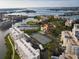 Wide aerial photo of the community showcasing intercoastal access, tennis courts, and buildings at 7932 Sailboat Key S Blvd # 806, South Pasadena, FL 33707