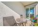 Enjoy the balcony with outdoor seating and sliding door access to the interior of the condo at 7932 Sailboat Key S Blvd # 806, South Pasadena, FL 33707