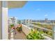 Enjoy this condo balcony view with tile floor, white railing, and beautiful blue skies at 7932 Sailboat Key S Blvd # 806, South Pasadena, FL 33707