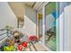 View of balcony space with tile floor, and a glimpse into the residence with a sliding door at 7932 Sailboat Key S Blvd # 806, South Pasadena, FL 33707
