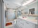 Bathroom featuring dual glass bowl sinks and a modern glass-enclosed shower at 7932 Sailboat Key S Blvd # 806, South Pasadena, FL 33707