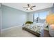 Cozy bedroom with large windows and a sliding glass door opening onto a private balcony at 7932 Sailboat Key S Blvd # 806, South Pasadena, FL 33707