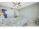 Bright bedroom featuring a ceiling fan, ensuite bathroom and closet doors at 7932 Sailboat Key S Blvd # 806, South Pasadena, FL 33707