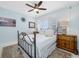 Well-lit bedroom offering a ceiling fan and charming decor with an area rug at 7932 Sailboat Key S Blvd # 806, South Pasadena, FL 33707