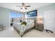 Well-lit bedroom with a sliding glass door to the balcony and nautical themed decorations at 7932 Sailboat Key S Blvd # 806, South Pasadena, FL 33707