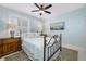 Comfortable bedroom featuring light-blocking shutters and ample space at 7932 Sailboat Key S Blvd # 806, South Pasadena, FL 33707