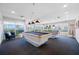 Well-lit billiards room with two pool tables and large windows offering scenic views at 7932 Sailboat Key S Blvd # 806, South Pasadena, FL 33707