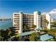 Multi-story condo building with covered parking, bay views and manicured landscaping at 7932 Sailboat Key S Blvd # 806, South Pasadena, FL 33707