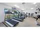 Modern fitness center with treadmills, ellipticals, and other exercise equipment overlooking a pool at 7932 Sailboat Key S Blvd # 806, South Pasadena, FL 33707