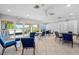 Inviting game room featuring tables, chairs, and a large window with outdoor views at 7932 Sailboat Key S Blvd # 806, South Pasadena, FL 33707