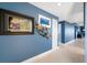Hallway featuring decorative wall art and doorway into living area at 7932 Sailboat Key S Blvd # 806, South Pasadena, FL 33707