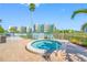 Enjoy the outdoors with this private hot tub surrounded by a privacy fence, lounge chairs and lush landscaping at 7932 Sailboat Key S Blvd # 806, South Pasadena, FL 33707