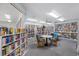 Cozy library with extensive bookshelves, reading tables, and comfortable seating at 7932 Sailboat Key S Blvd # 806, South Pasadena, FL 33707