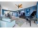 Open concept living room with piano, barstool seating, and views to the kitchen at 7932 Sailboat Key S Blvd # 806, South Pasadena, FL 33707