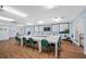 Functional meeting room with a large conference table, TV, and storage cabinets at 7932 Sailboat Key S Blvd # 806, South Pasadena, FL 33707