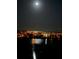 Night view of lighted waterfront buildings at 7932 Sailboat Key S Blvd # 806, South Pasadena, FL 33707
