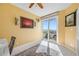 Office space featuring sliding glass doors to balcony, ceiling fan and beautiful flooring at 7932 Sailboat Key S Blvd # 806, South Pasadena, FL 33707