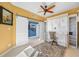 Office space with built in desk, sliding shutter doors, ceiling fan and beautiful flooring at 7932 Sailboat Key S Blvd # 806, South Pasadena, FL 33707
