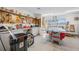 Well-equipped workshop with various tools, workbenches, and natural light from windows at 7932 Sailboat Key S Blvd # 806, South Pasadena, FL 33707