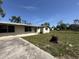 View of the backyard with mature trees, and an enclosing fence at 9526 Eastfield Rd, Thonotosassa, FL 33592