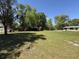 Expansive yard with mature trees creating a serene, natural setting at 9526 Eastfield Rd, Thonotosassa, FL 33592