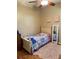 Inviting bedroom with ceiling fan, cozy rug, and comfortable bed at 9613 Jasmine Brook Crk, Land O Lakes, FL 34638