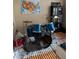 Bedroom with a drum set, gray area rug, and map of United States hanging on the wall at 9613 Jasmine Brook Crk, Land O Lakes, FL 34638