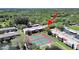 Aerial view of complex showcasing the tennis courts, landscaping, and building's location and layout at 9700 Starkey Rd # 321, Seminole, FL 33777