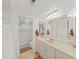 Bright bathroom features a walk-in shower, neutral tiling and cabinetry at 9700 Starkey Rd # 321, Seminole, FL 33777