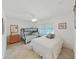Neutral bedroom showcasing a bunk bed and one full bed with natural light at 9700 Starkey Rd # 321, Seminole, FL 33777
