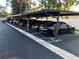 Covered parking area with multiple parking spaces, providing protection from the elements for residents' vehicles at 9700 Starkey Rd # 321, Seminole, FL 33777