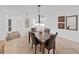 Dining area with a marble table and view of decorations on the wall at 9700 Starkey Rd # 321, Seminole, FL 33777