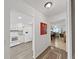 Inviting hallway leading to the kitchen, dining, and living area with neutral tones at 9700 Starkey Rd # 321, Seminole, FL 33777