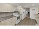 Charming white kitchen with ample storage, modern appliances, and granite countertops at 9700 Starkey Rd # 321, Seminole, FL 33777