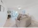 Bright living room featuring a comfortable sofa, and a view of the outdoor patio at 9700 Starkey Rd # 321, Seminole, FL 33777