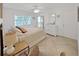 Bright main bedroom with ample natural light, queen-sized bed, and a dresser at 9700 Starkey Rd # 321, Seminole, FL 33777