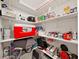 Well-organized pantry with shelves stocked with food, supplies, and storage containers for kitchen essentials at 9700 Starkey Rd # 321, Seminole, FL 33777