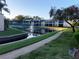 Beautiful community pond with fountain, tennis court, and walking path for residents to enjoy at 9700 Starkey Rd # 321, Seminole, FL 33777