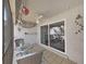 A covered porch features a ceiling fan and an outdoor seating area at 9700 Starkey Rd # 321, Seminole, FL 33777