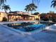 Sparkling community swimming pool with lounge chairs, perfect for relaxation and recreation in the sun at 9700 Starkey Rd # 321, Seminole, FL 33777