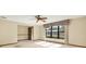 Bright bedroom with large window, ceiling fan, neutral carpet, and ensuite entrance at 10014 118Th Way, Seminole, FL 33772
