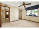 Comfortable bedroom with neutral walls and a window with a view at 10014 118Th Way, Seminole, FL 33772