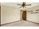 Bedroom with a ceiling fan and built-in shelving at 10014 118Th Way, Seminole, FL 33772